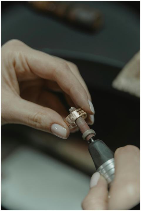 Detailed shot of a skilled jeweler meticulously po