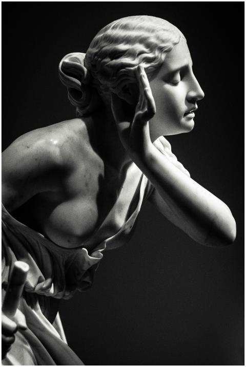 Graceful marble statue of a woman, capturing an ar