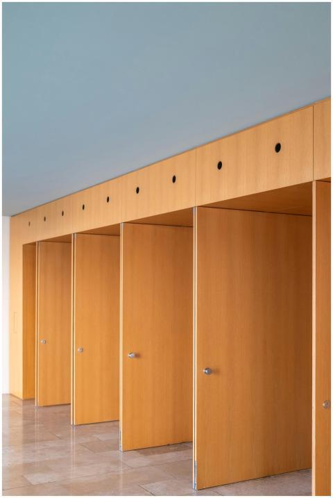 Five wooden doors in a modern interior, showcasing