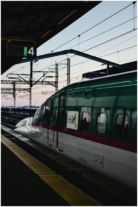 A sleek bullet train at Tokyo Station during a ser