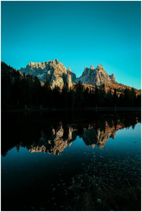 Captivating mountain landscape reflecting in a tra