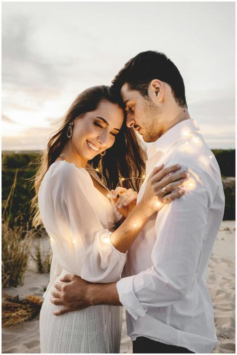 Side view of romantic soulmates embracing gently w