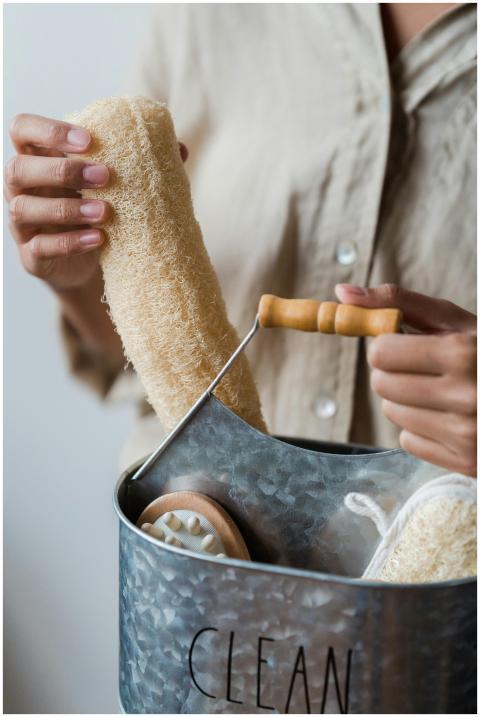 Close-up shot of a person holding a loofah sponge