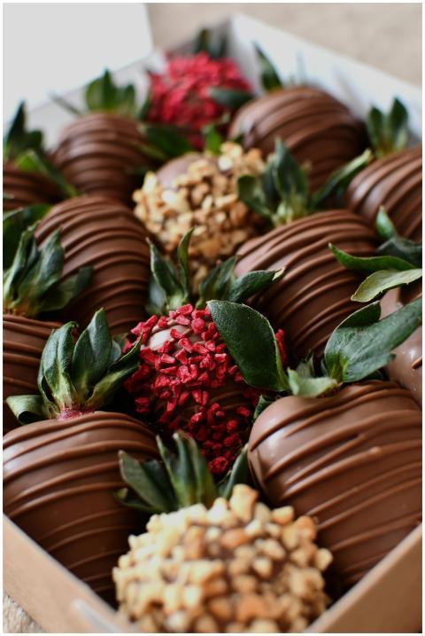 Tempting chocolate-covered strawberries with assor