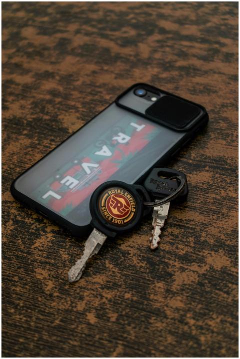 Close-up of a smartphone with travel sticker and m