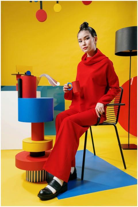 Conceptual portrait of a woman in red outfit with