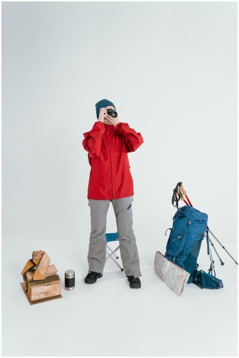 Woman in winter clothing preparing for hiking with