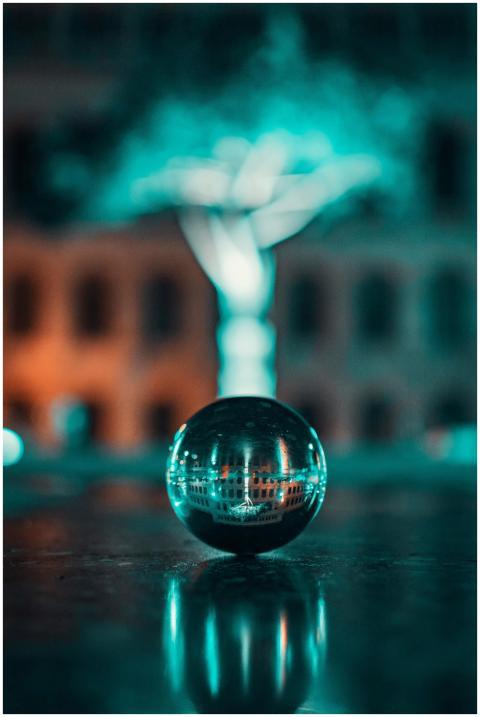 Artistic night shot of a crystal ball reflecting a
