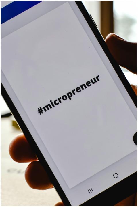 Close-up of a hand holding a smartphone with the h