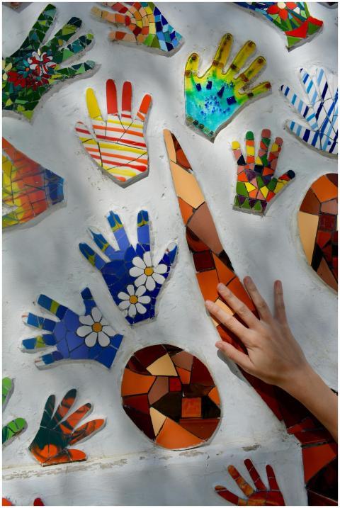 Colorful mosaic hand prints and abstract shapes cr