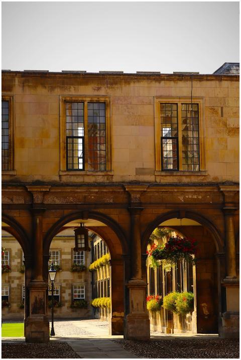 Historic stone building with arched walkways, larg