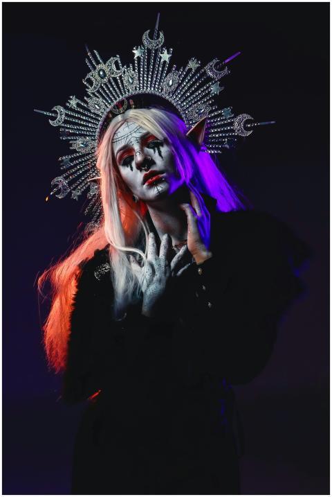 A striking gothic portrait of an elven queen with