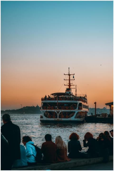 A ferry approaches the dock at sunset in Beşiktaş,
