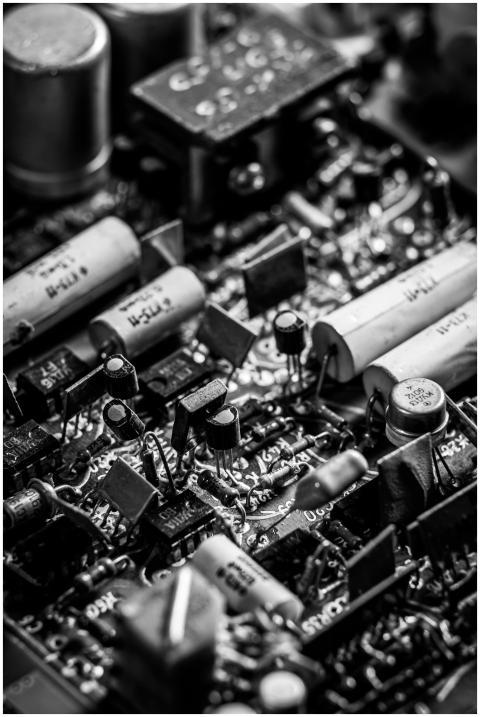 Detailed grayscale photo of electronic circuit boa