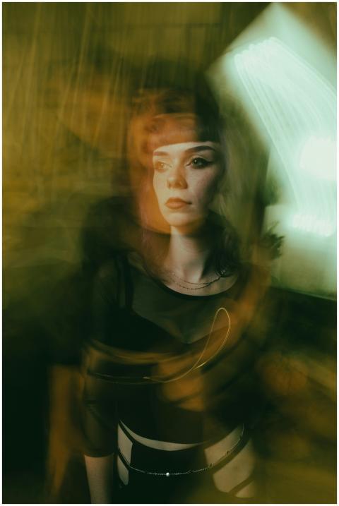 Dynamic portrait capturing a woman with a unique m