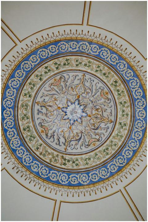High-angle view of an ornate ceiling medallion wit