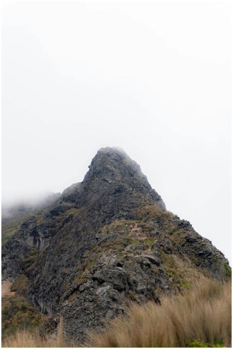 Captivating view of a misty mountain peak near Qui
