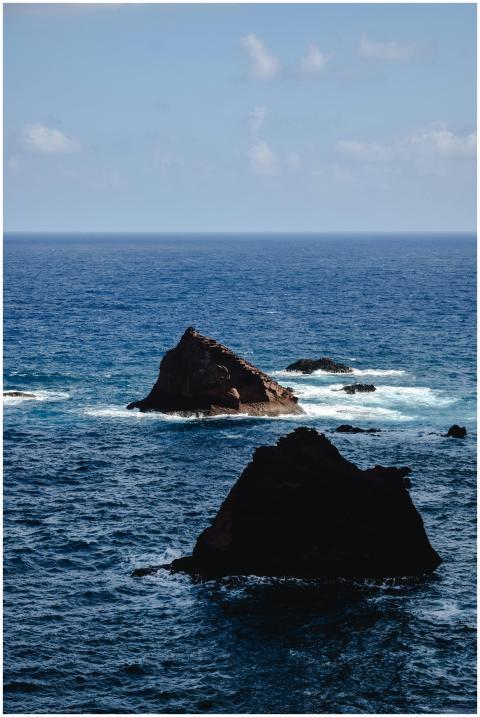 Panoramic view of the ocean with striking rock for