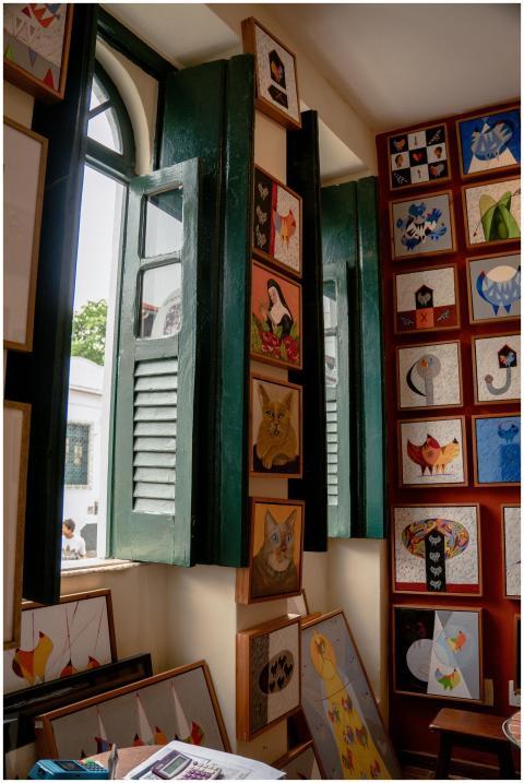 Cozy indoor art gallery featuring colorful paintin