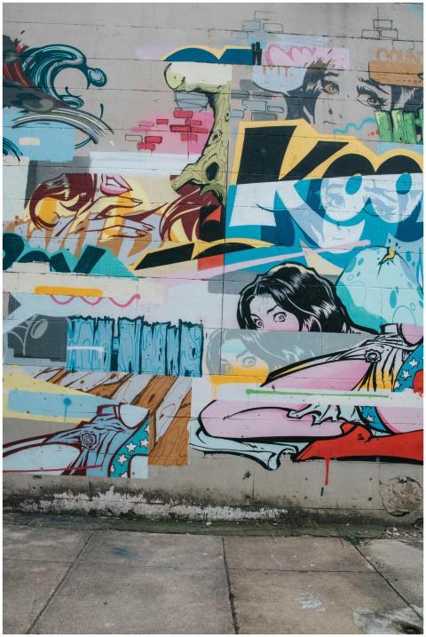 Colorful graffiti mural featuring various artistic