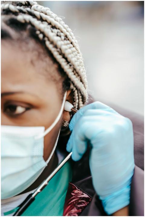 Crop adult African American female doctor in medic