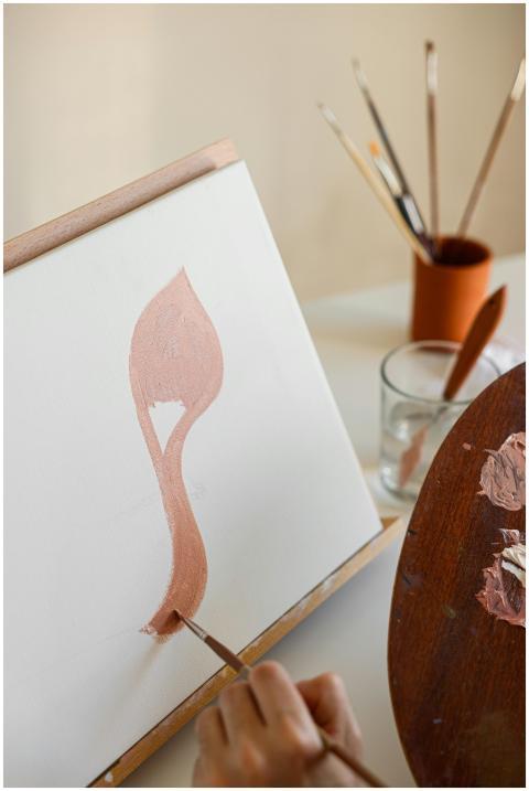 A minimalist abstract painting in progress on canv