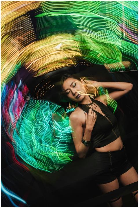 Dynamic portrait of a woman surrounded by vibrant