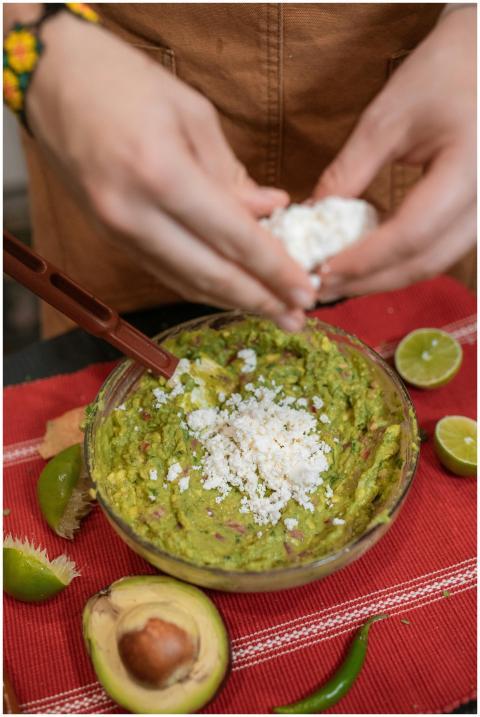 Close-up of fresh homemade guacamole with feta che