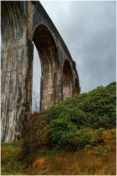 Dramatic view of an ancient stone viaduct arching