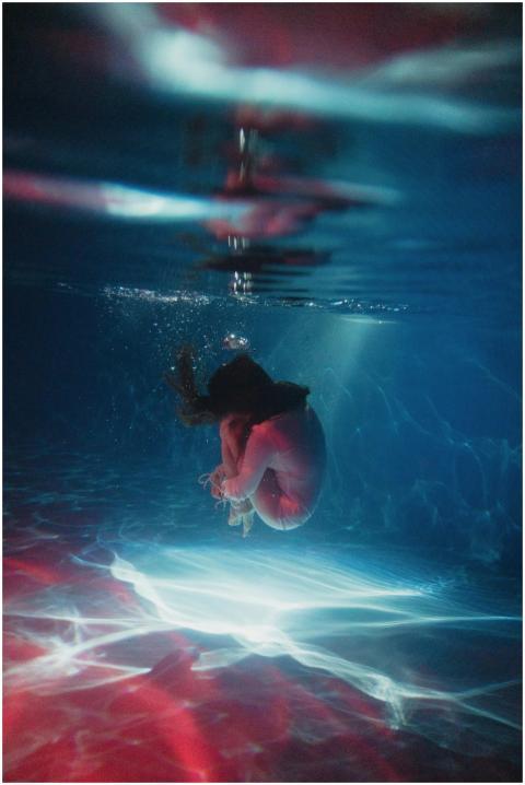 Captivating underwater scene of a woman gracefully
