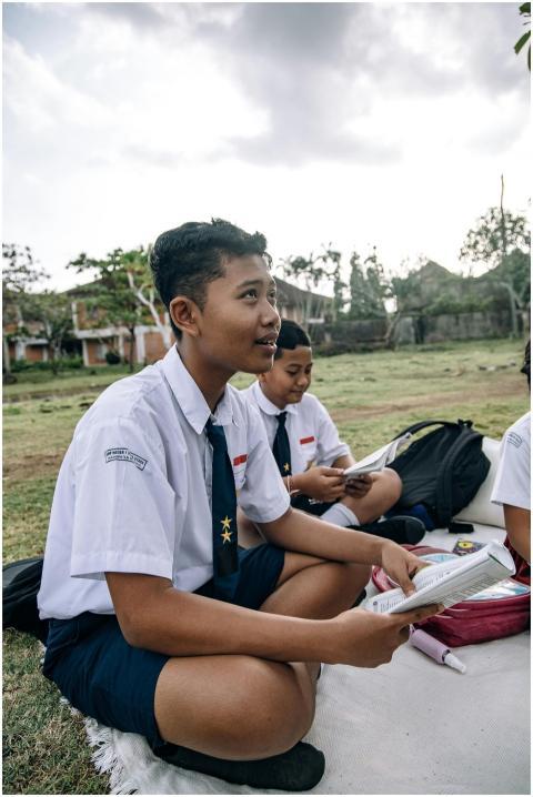 Group of Asian students in school uniforms studyin
