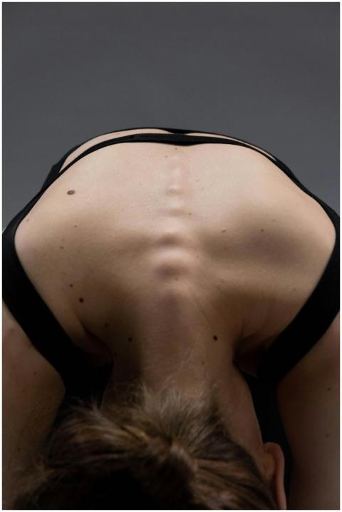 Close-up of a woman in a yoga pose highlighting th