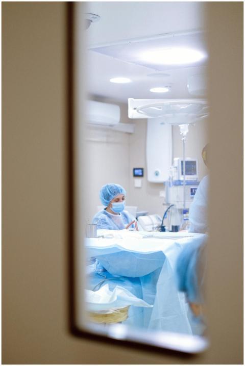 View of a surgeon working in an operating room thr
