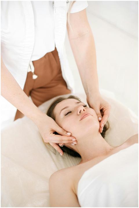 A soothing facial massage therapy session promotin