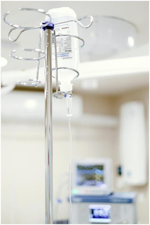 Close-up of an IV drip in a sterile hospital setti