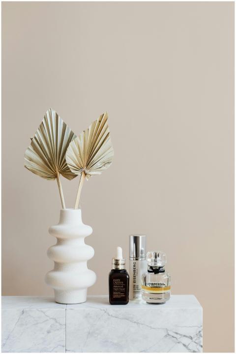 Aesthetic arrangement of skincare products and dri