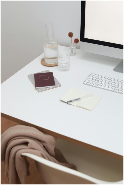 Workplace with wireless keyboard and monitor near