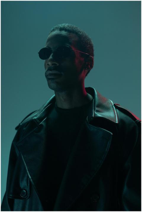 Stylish man in sunglasses and leather jacket with