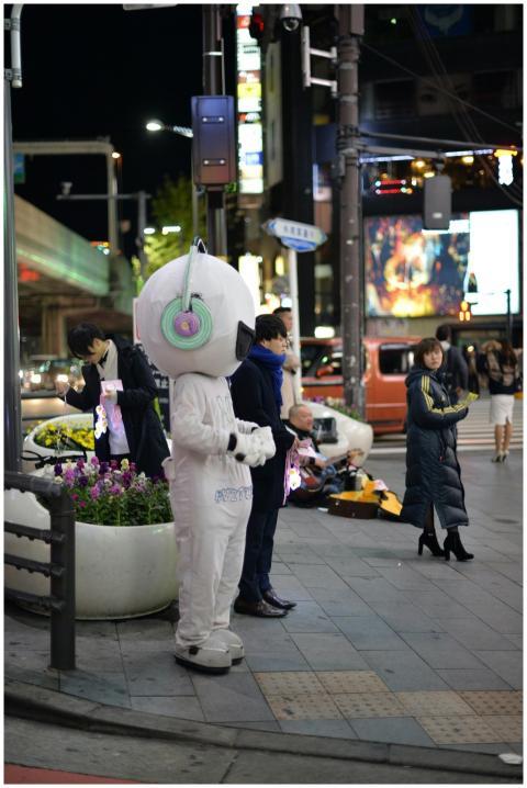 A vibrant night scene at a Tokyo intersection feat