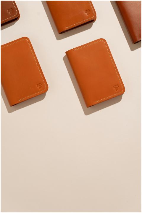 High-quality leather wallets displayed against a c