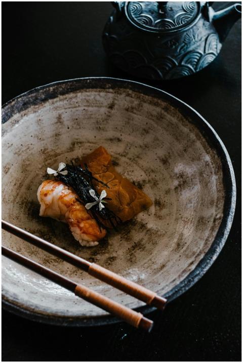 A beautifully plated sushi dish with a traditional
