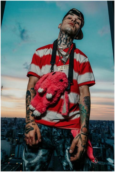 Dynamic urban portrait of a tattooed individual wi