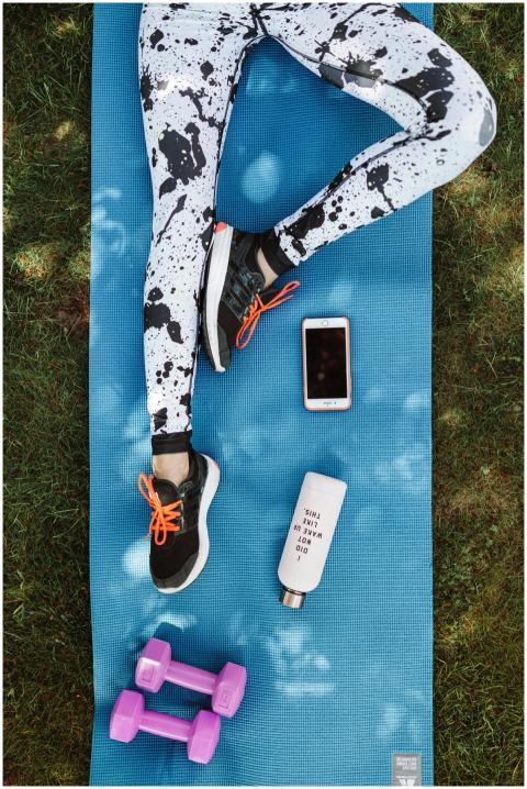 Flat lay of workout essentials on a yoga mat, idea