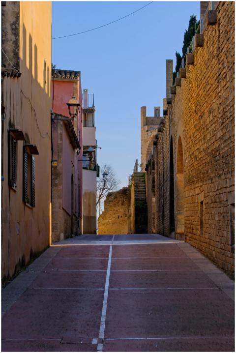 Scenic view of a sunlit street in Alcúdia, Spain,