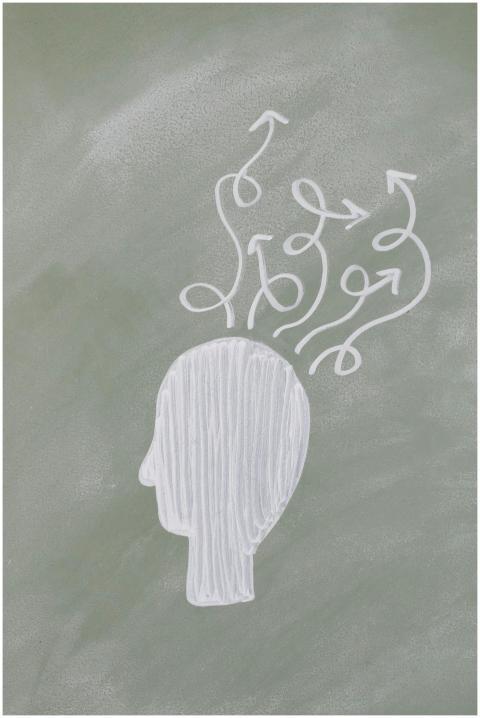 Chalk outline of a head with swirling arrows depic