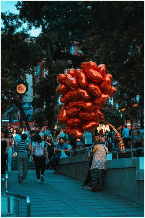 Busy urban street filled with people and a vendor