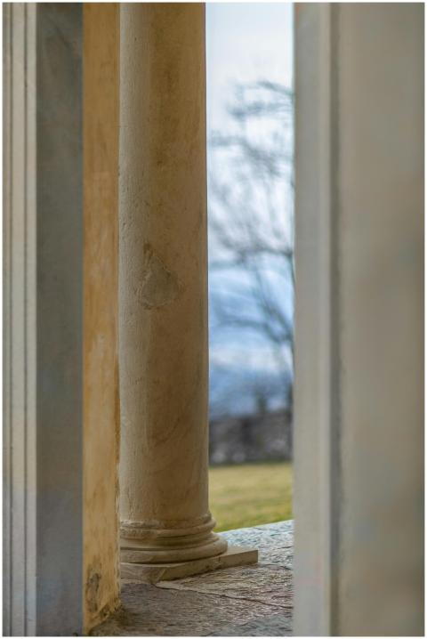 Close-up of a neoclassical column with a scenic vi