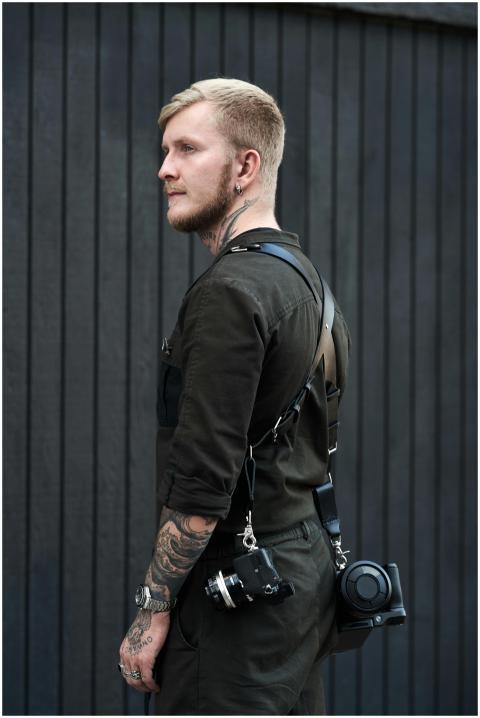 Side view of serious young bearded male photograph