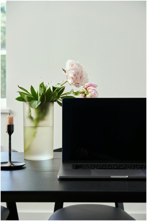 A minimalist home office setup featuring a laptop