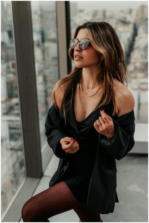 Chic urban portrait of a woman in sunglasses with